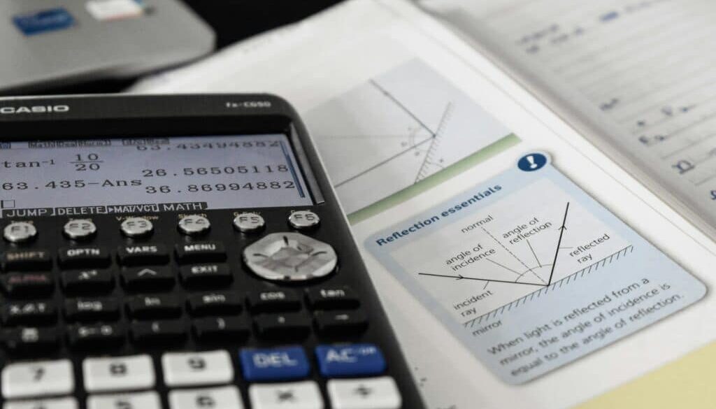 Calculator and textbook on reflection principles.