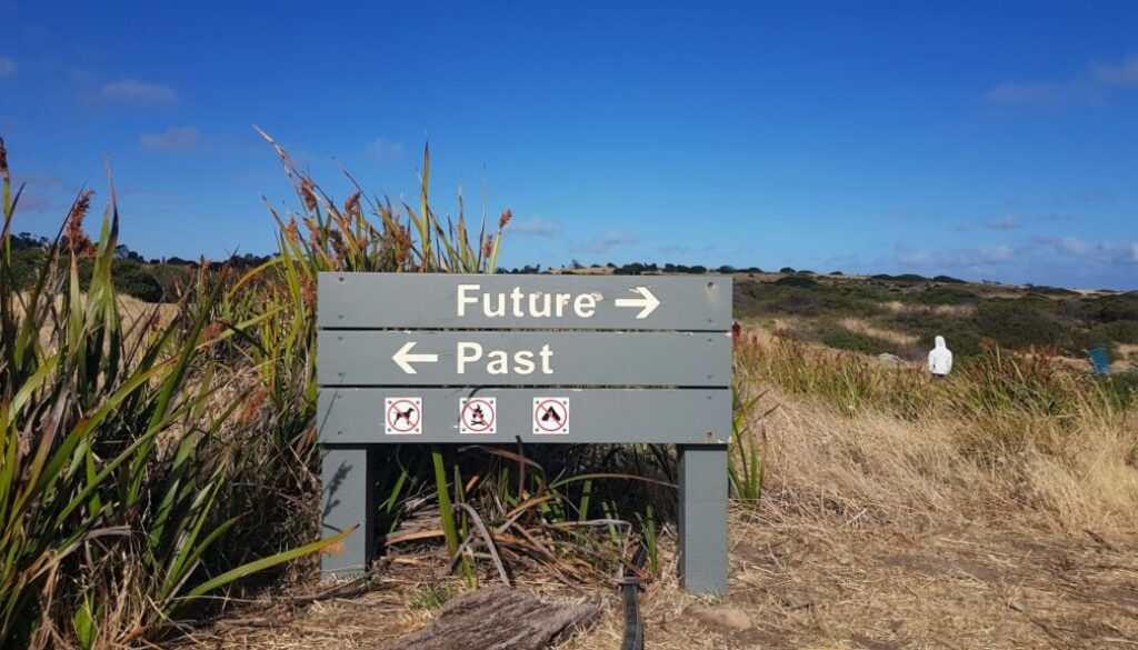Signpost indicating future and past directions.