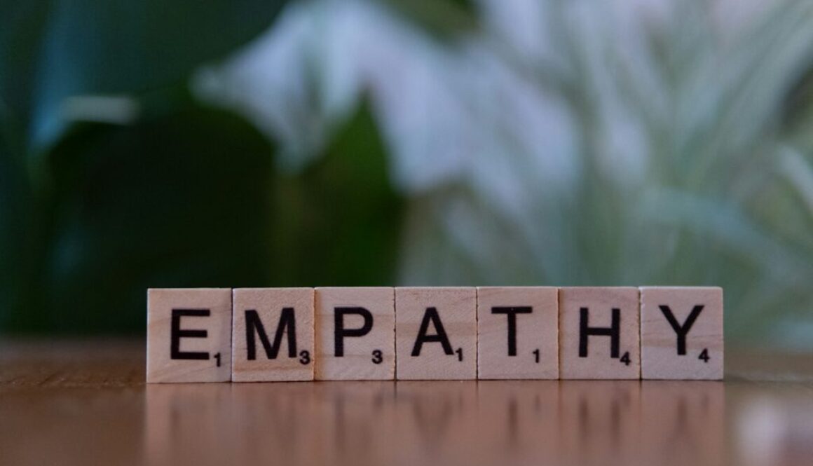 Wooden blocks spelling the word 'EMPATHY'