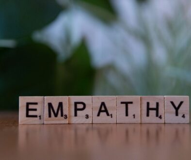 Wooden blocks spelling the word 'EMPATHY'